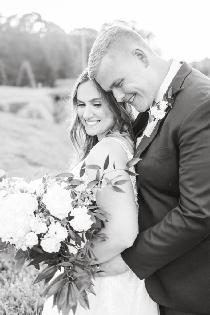 bride and groom hugging - black and white photo