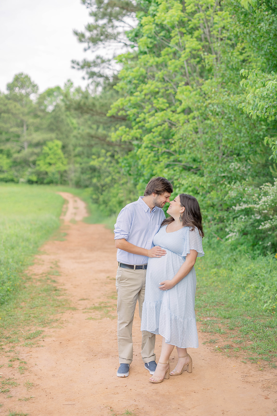 maternity photo session of couple at green meadows preserve in marietta georgia