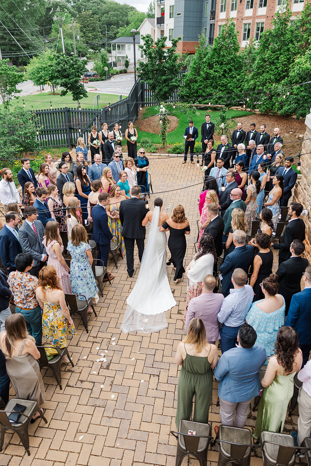 A look down on mom and dad walking the bride down the aisle for her Upstairs Atlanta Wedding ceremony
