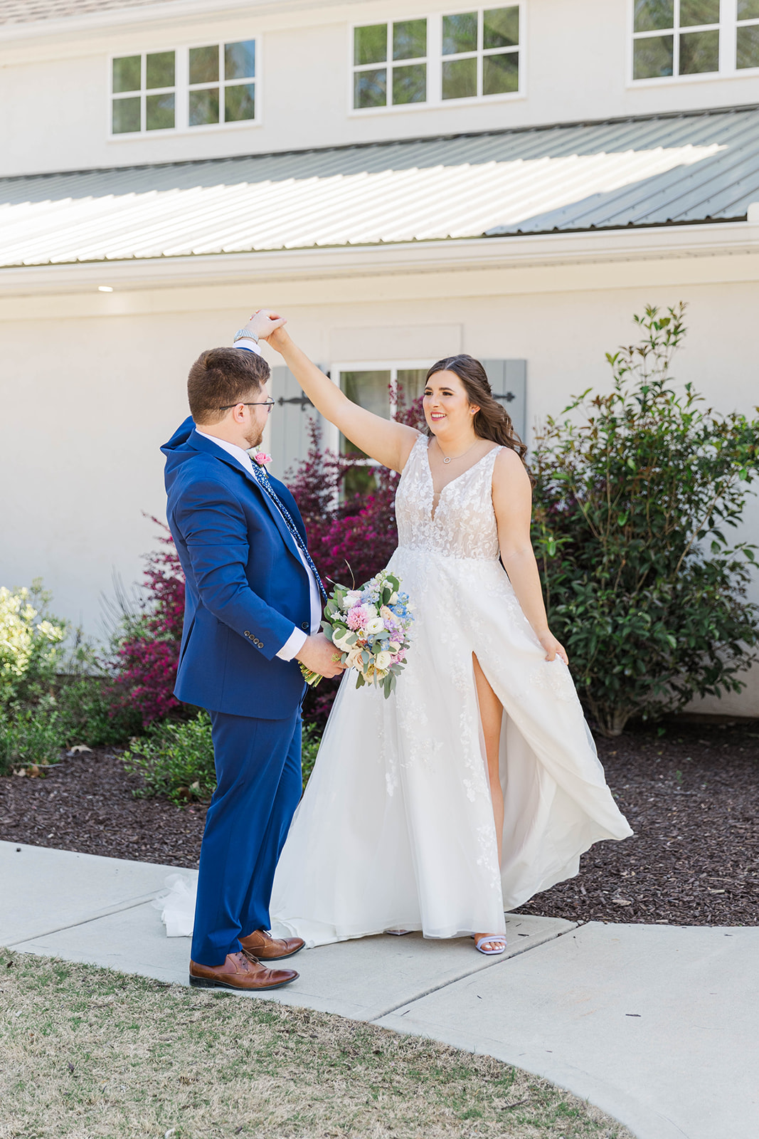 Newlyweds dance in the sidewalk during their wedding