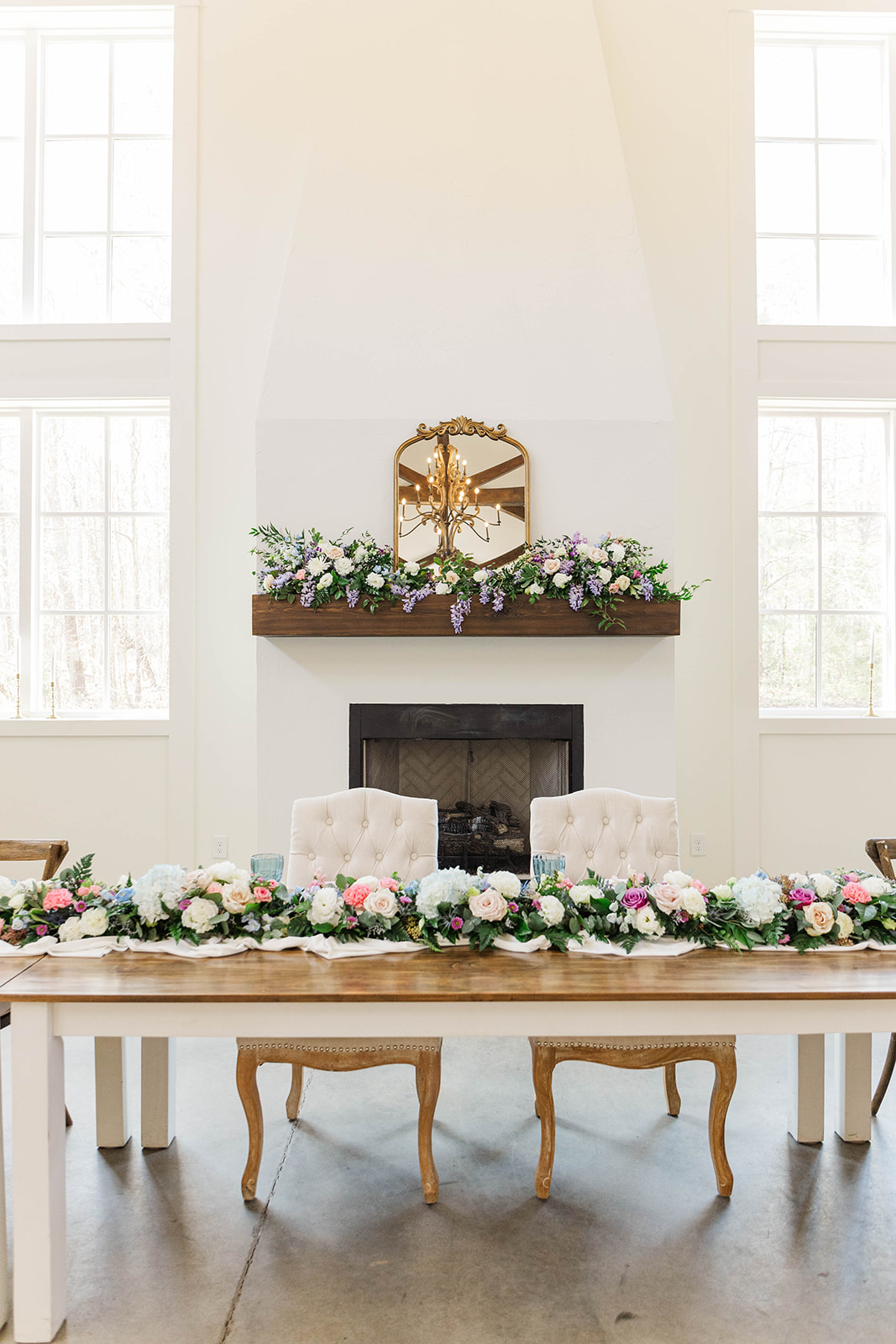 Details of the White Fox Cottage wedding reception head table in front a fireplace