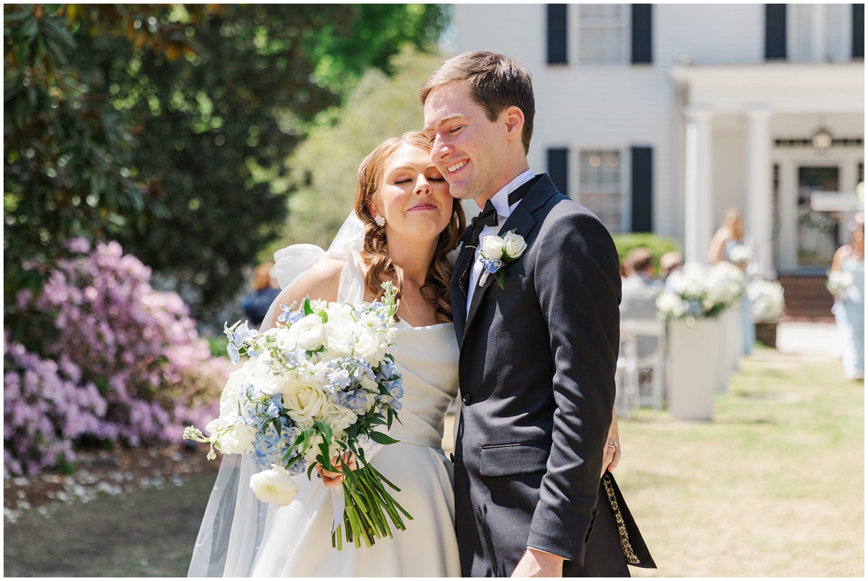 Newlyweds share a hug and smile after their ceremony in the lawn