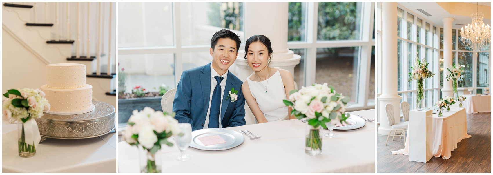 A bride and groom sit smiling at their reception head table with white florals and linens